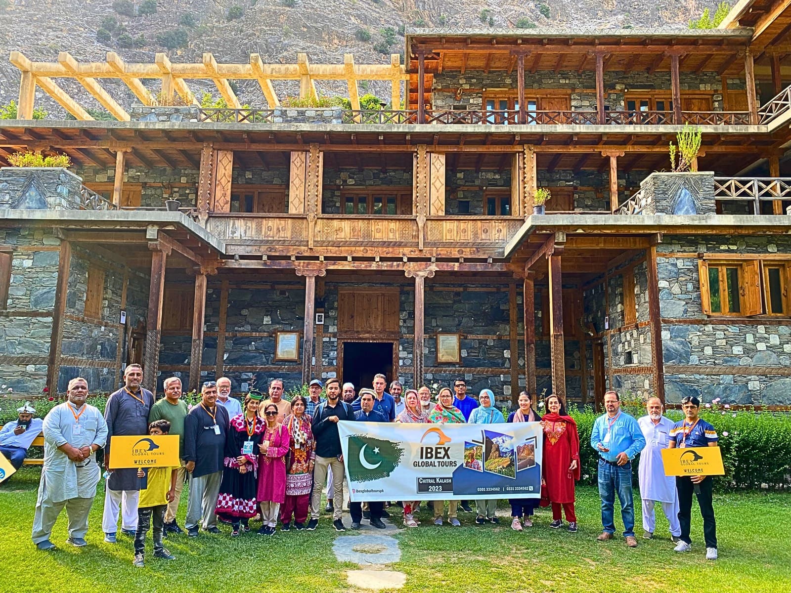 An IBEX group photographed outside the timber and stone Kalasha Dur Museum in Bamboret