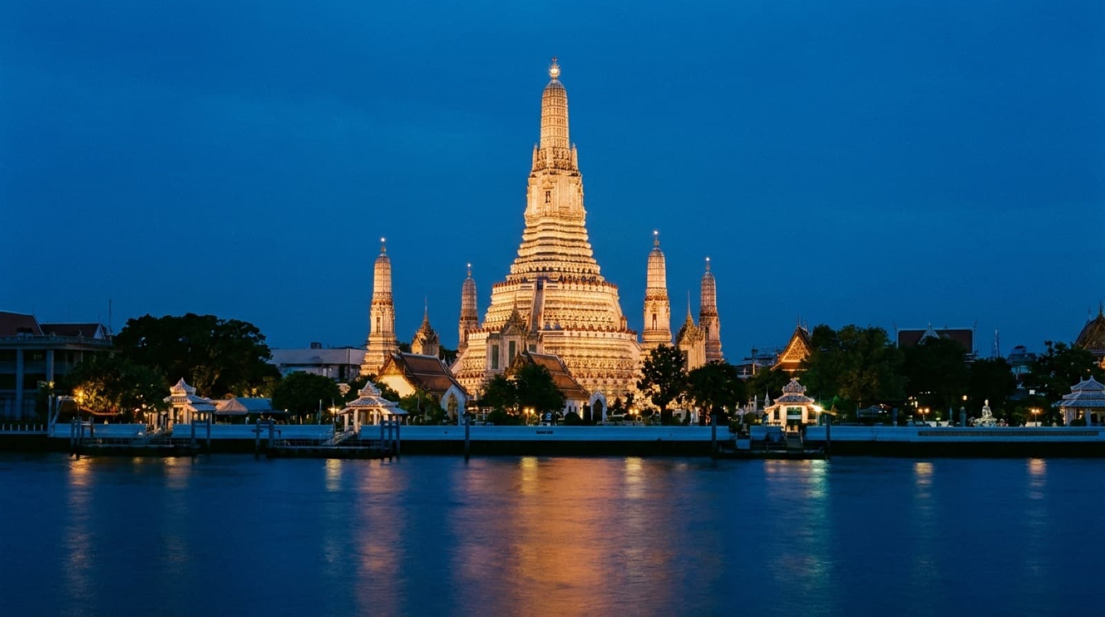 Wat Arun on the Chao Phraya river in Bangkok at blue hour