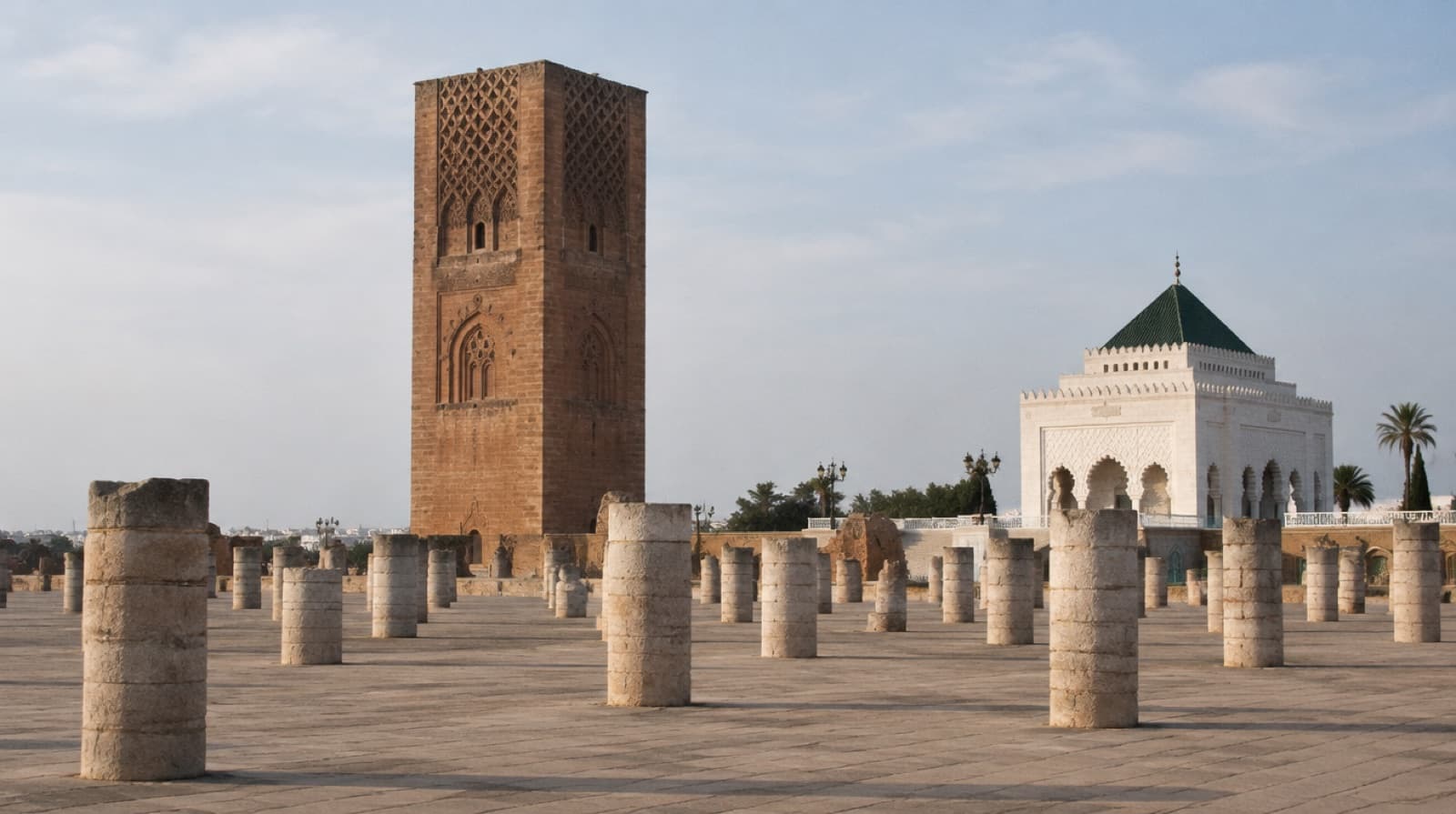 The Hassan Tower in Rabat above rows of column stumps, the Mausoleum of Mohammed V beside it