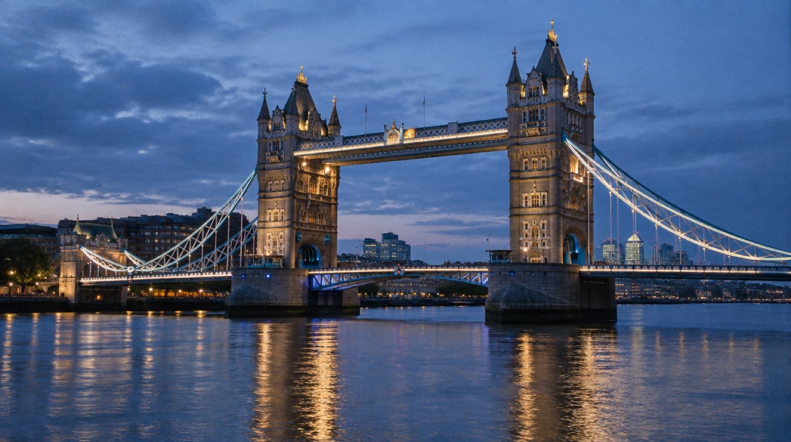 Tower Bridge over the Thames lit at dusk